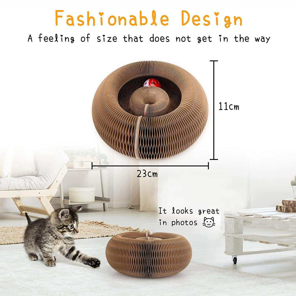 A round corrugated cardboard cat play sofa shown in a bright living room with a kitten nearby, plus overlaid dimension lines reading 23cm wide and 11cm tall, and marketing text about fashionable design and scale.